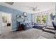 Bright living room with stylish decor, a comfortable couch and large windows at 1300 Enfield Ln, Mount Pleasant, SC 29466