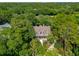 Aerial view of a home surrounded by lush green trees, showcasing its prime location and serene environment at 132 Turnberry Dr, Johns Island, SC 29455
