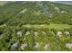 Expansive aerial view of a golf course community surrounded by lush trees and winding waterways at 132 Turnberry Dr, Johns Island, SC 29455