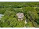 Aerial view of a home surrounded by lush green trees, showcasing its prime location and serene environment at 132 Turnberry Dr, Johns Island, SC 29455