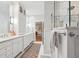 Bright bathroom features a double sink and a large mirror at 132 Turnberry Dr, Johns Island, SC 29455