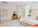 Spacious bedroom with natural lighting, high ceilings, neutral carpet, and a doorway to the hall at 132 Turnberry Dr, Johns Island, SC 29455