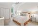 Inviting bedroom with large windows, neutral carpet, bed with patterned bedding, and white walls at 132 Turnberry Dr, Johns Island, SC 29455