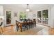 Spacious dining area with ample seating, natural light, and backyard views at 132 Turnberry Dr, Johns Island, SC 29455