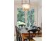 Dining room with rustic wooden table and chairs, featuring outdoor views at 132 Turnberry Dr, Johns Island, SC 29455