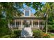 Well maintained home with mature landscaping, columns and a large front porch at 132 Turnberry Dr, Johns Island, SC 29455