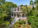 Charming two-story home with large front porch and landscaped front yard at 132 Turnberry Dr, Johns Island, SC 29455