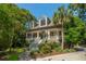 Elegant home with a large porch, columns, manicured landscaping and inviting curb appeal at 132 Turnberry Dr, Johns Island, SC 29455
