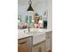 Bright kitchen featuring a farmhouse sink, stainless steel appliances, and open floor plan at 132 Turnberry Dr, Johns Island, SC 29455