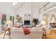 Spacious living room with high ceilings, fireplace, and access to the outdoors at 132 Turnberry Dr, Johns Island, SC 29455