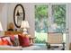 Cozy living room with a view of the lush backyard and pool through French doors at 132 Turnberry Dr, Johns Island, SC 29455