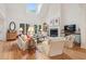 Bright, airy living room with fireplace, vaulted ceiling, and ample seating at 132 Turnberry Dr, Johns Island, SC 29455