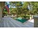 Inviting pool with deck and lounge chairs, perfect for relaxation and enjoying the surrounding greenery at 132 Turnberry Dr, Johns Island, SC 29455