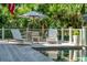 Modern pool deck with lounge chairs and dining area, perfect for outdoor entertaining at 132 Turnberry Dr, Johns Island, SC 29455
