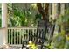 Relaxing porch with rocking chairs, providing a serene spot to enjoy the surrounding landscape at 132 Turnberry Dr, Johns Island, SC 29455
