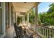 Inviting porch featuring rocking chairs and views of lush greenery, perfect for relaxation at 132 Turnberry Dr, Johns Island, SC 29455