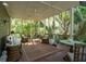 Cozy screened porch with comfortable seating and a ceiling fan, ideal for outdoor living at 132 Turnberry Dr, Johns Island, SC 29455