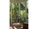 Relaxing screened porch with a hanging chair and scenic views, perfect for unwinding at 132 Turnberry Dr, Johns Island, SC 29455