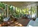 Comfortable screened porch with wicker furniture and serene views, great for relaxation at 132 Turnberry Dr, Johns Island, SC 29455