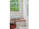Cozy window seat with colorful cushion and pillows, perfect for reading in natural light at 132 Turnberry Dr, Johns Island, SC 29455
