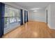 Bright dining room with hardwood floors, large windows, and access to the outdoor porch at 133 Bramwell Dr, Summerville, SC 29485