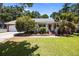 Inviting front exterior featuring a red front door, brick steps, and mature trees creating a warm welcome at 133 Bramwell Dr, Summerville, SC 29485