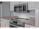 Modern stainless steel oven and microwave appliances with granite countertops at 133 Bramwell Dr, Summerville, SC 29485