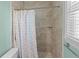 The bathroom features a tiled walk-in shower with a shower curtain at 133 Bramwell Dr, Summerville, SC 29485