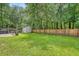 Large backyard with a well-maintained lawn, patio, privacy fence and shed at 138 Wainwright Manor, Summerville, SC 29485