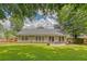 Spacious backyard featuring a well-maintained lawn and patio perfect for outdoor gatherings at 138 Wainwright Manor, Summerville, SC 29485