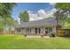 Wide backyard with a patio, perfect for entertaining or enjoying peaceful outdoor moments at 138 Wainwright Manor, Summerville, SC 29485
