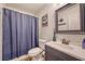 Full bathroom with a shower, toilet, vanity, mirror and blue accents at 138 Wainwright Manor, Summerville, SC 29485