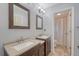 Bathroom with double sink vanity, framed mirrors and tiled floors at 138 Wainwright Manor, Summerville, SC 29485