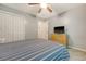 Bedroom with a ceiling fan and a TV above the wooden dresser at 138 Wainwright Manor, Summerville, SC 29485