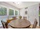 Breakfast nook features a round wood table, seating for four, and lots of natural light at 138 Wainwright Manor, Summerville, SC 29485