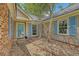 Charming front entrance with beautiful blue shutters and a well-maintained walkway at 138 Wainwright Manor, Summerville, SC 29485