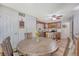 Open kitchen featuring a round wooden dining table with chairs and stainless steel appliances at 138 Wainwright Manor, Summerville, SC 29485