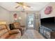 Living room with comfortable seating, television, and a large window at 138 Wainwright Manor, Summerville, SC 29485