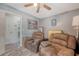 Comfortable living room featuring plush reclining chairs and a ceiling fan at 138 Wainwright Manor, Summerville, SC 29485