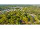 Lush tree canopy surrounds a home, offering privacy and shade in a neighborhood setting at 1518 Southwick Dr, Johns Island, SC 29455
