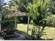 Backyard shaded picnic area featuring a sturdy table and natural landscaping at 1518 Southwick Dr, Johns Island, SC 29455