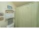 Functional bathroom with a shower curtain, cabinet, and toilet in a compact space at 1518 Southwick Dr, Johns Island, SC 29455