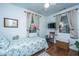 Comfortable bedroom features wood floors, two windows, and natural light at 1518 Southwick Dr, Johns Island, SC 29455