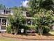 Inviting home exterior showcasing a cozy screened-in porch and well-maintained landscaping at 1518 Southwick Dr, Johns Island, SC 29455