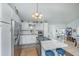 Bright kitchen featuring white cabinets, stainless steel appliances, and an island with a cooktop at 1518 Southwick Dr, Johns Island, SC 29455