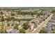 A beautiful aerial view showcases a community's pond, manicured landscaping, and stylish home exteriors at 1536 Keshi Pearl Dr, Mount Pleasant, SC 29466