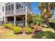 Well-maintained backyard featuring manicured landscaping, healthy green lawn, and a serene setting at 1536 Keshi Pearl Dr, Mount Pleasant, SC 29466