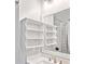 Charming bathroom features open shelving, a decorative mirror, and a clean design at 1536 Keshi Pearl Dr, Mount Pleasant, SC 29466