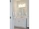 Well-lit bathroom featuring a large mirror, white vanity with storage, and modern fixtures at 1536 Keshi Pearl Dr, Mount Pleasant, SC 29466