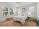 Bright bedroom features a large window, a ceiling fan, and simple decor at 1536 Keshi Pearl Dr, Mount Pleasant, SC 29466